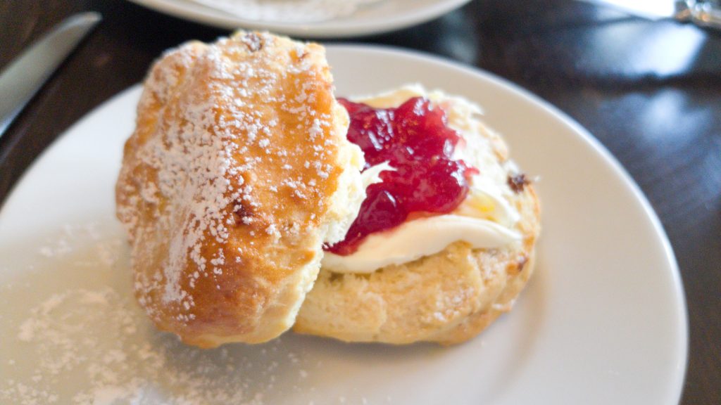 A plain scone served by hotel du vin as a part of their afternoon tea. Served with strawberry jam and clotted cream on the side.
