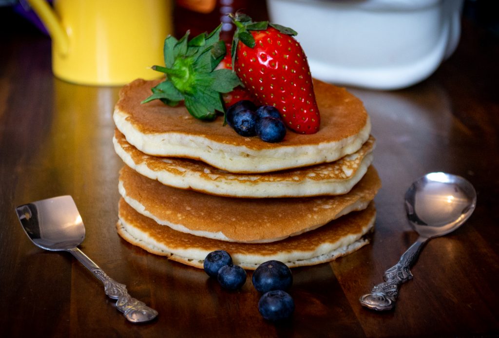 Buttermilk pancake stack with strawberries and blueberries