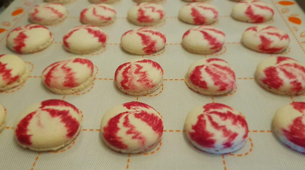 Mini Macarons cooling on the silicone baking mat