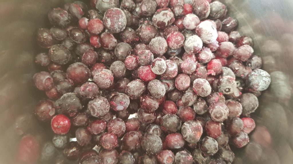 A pan full of frozen blueberries